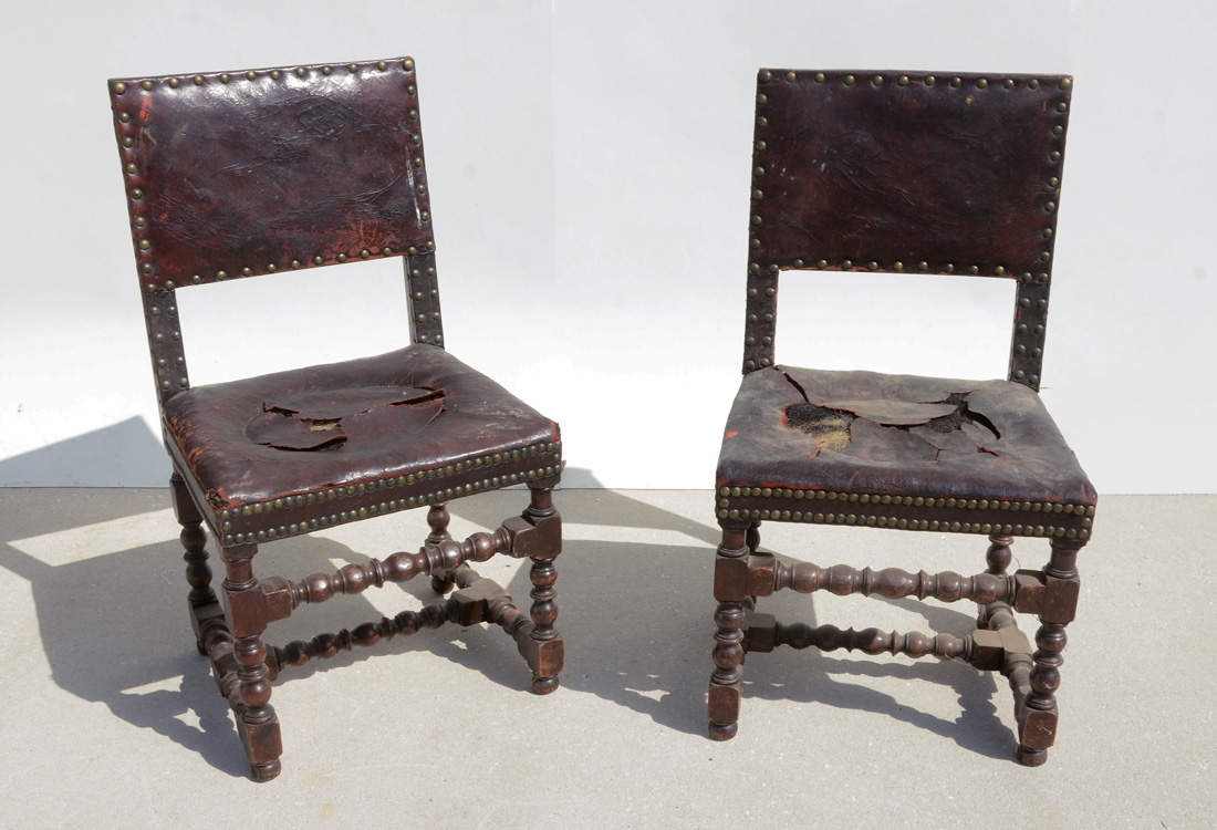 Appraisal: PAIR JACOBEAN STYLE LEATHER SIDE CHAIRS th century turned legs