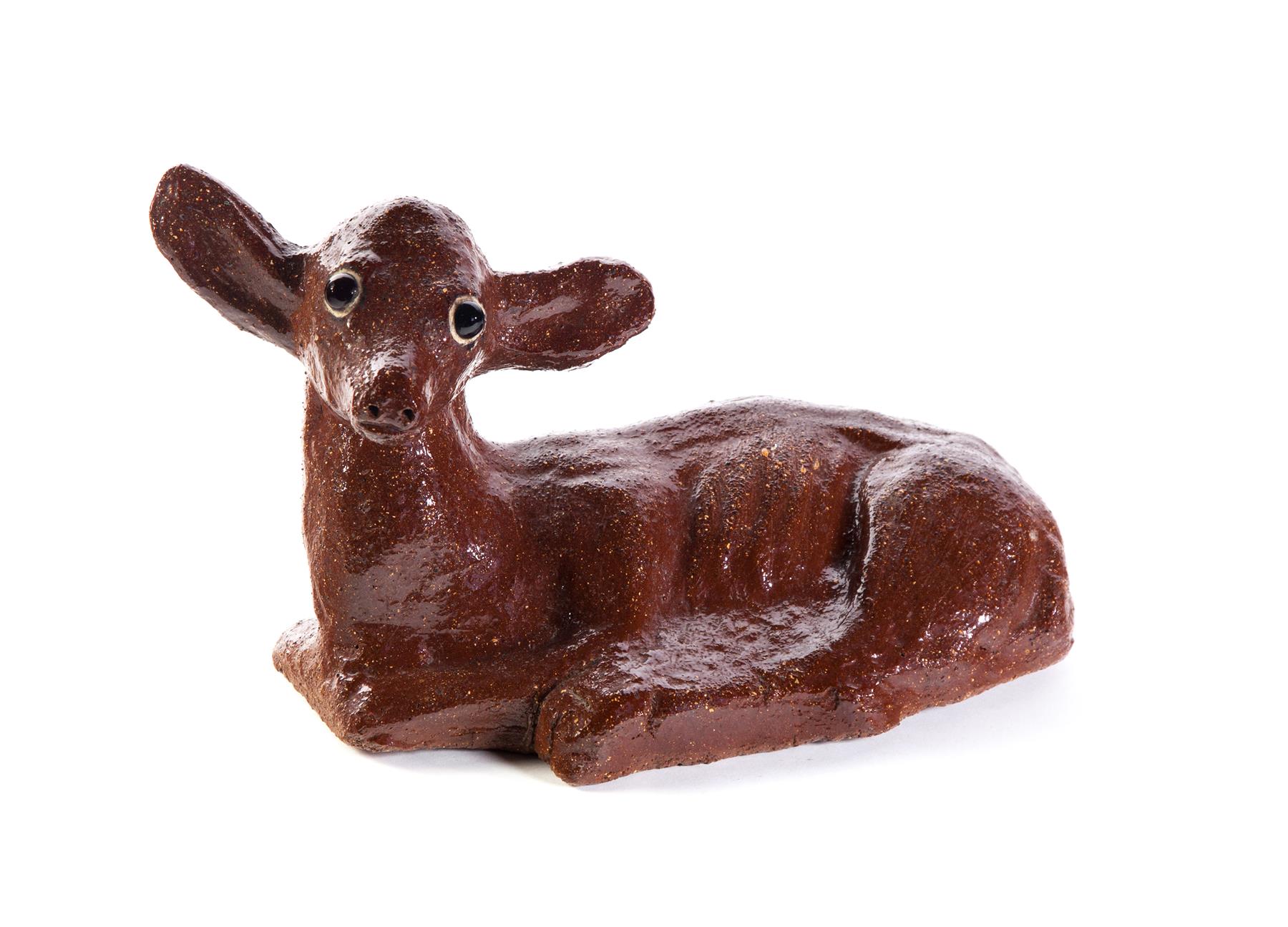 Appraisal: AMERICAN SEWERTILE DEER Mid th century Reclining deer with glass