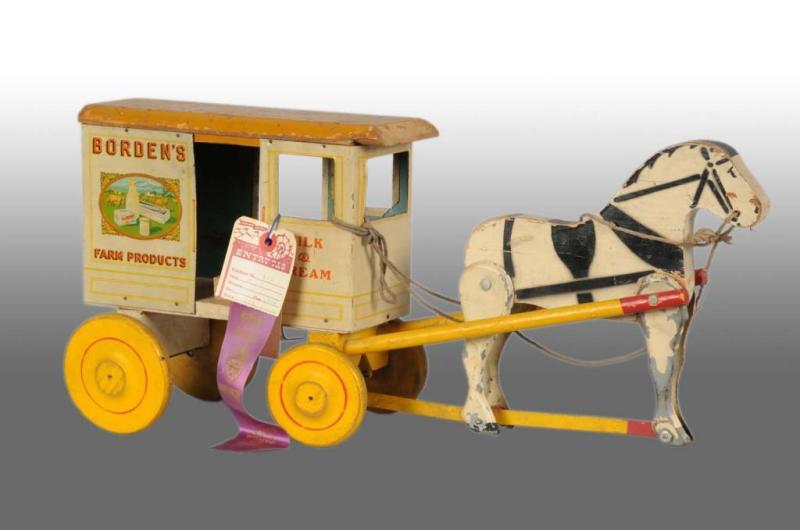 Appraisal: Rich Toys Borden's Milk Wagon Toy Description Pulled by articulated