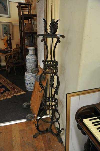 Appraisal: A CONTINENTAL STYLE WROUGHT IRON TORCHERE