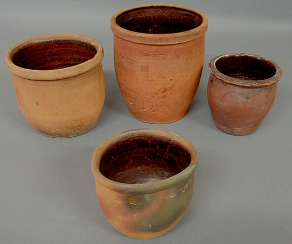 Appraisal: Four th c Pennsylvania redware jars largest signed John Bell