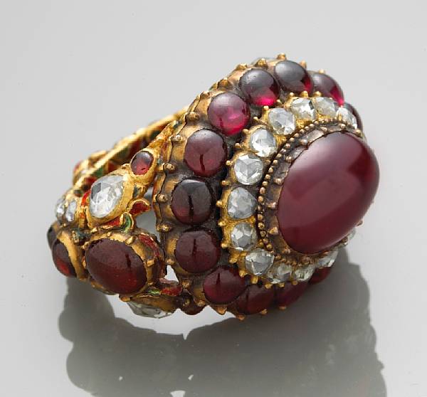 Appraisal: A garnet ruby diamond and enamel ring mounted in eighteen