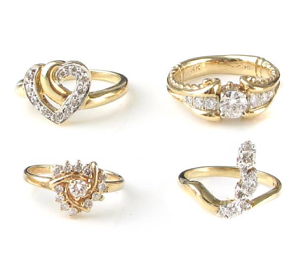 Appraisal: A collection of four diamond and k gold fashion rings