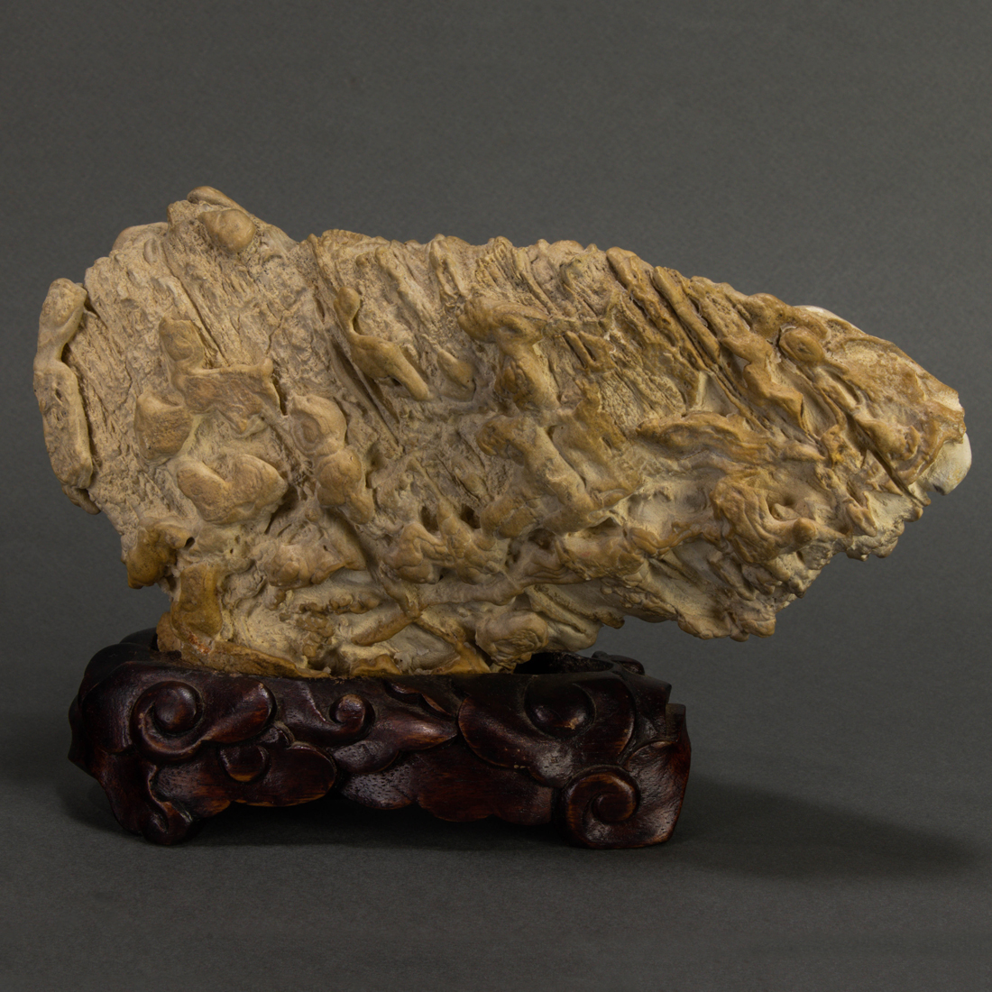 Appraisal: Chinese beige Qilian stone scholar's rock arranged horizontally with an