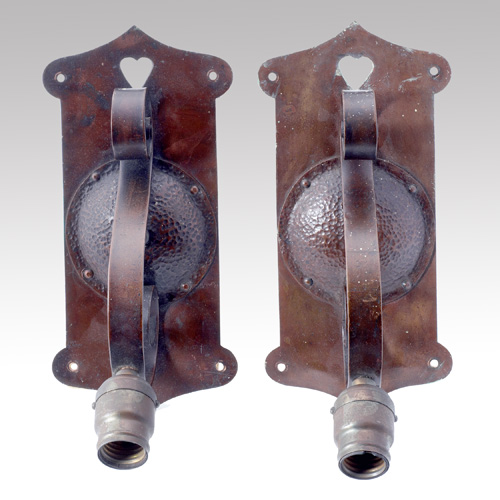 Appraisal: ROYCROFT Pair of hammered copper wall sconces with curdled handle