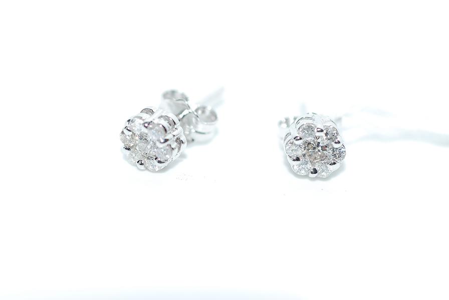 Appraisal: A PAIR OF DIAMOND CLUSTER STUD EARRINGS IN CT WHITE