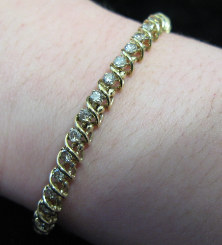 Appraisal: DIAMOND AND TEN KARAT GOLD BRACELET inches in length and