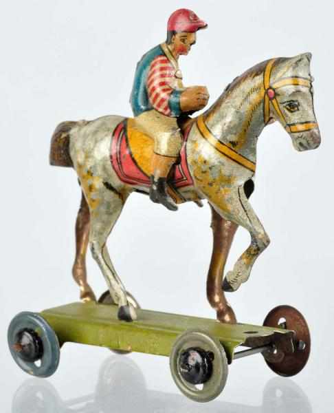 Appraisal: Tin Litho Jockey on Horse Penny Toy German Marked Germany