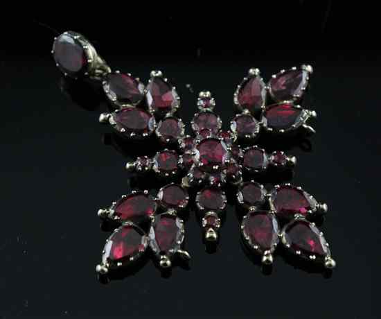 Appraisal: An early Victorian garnet set gold pendant in Estimate -