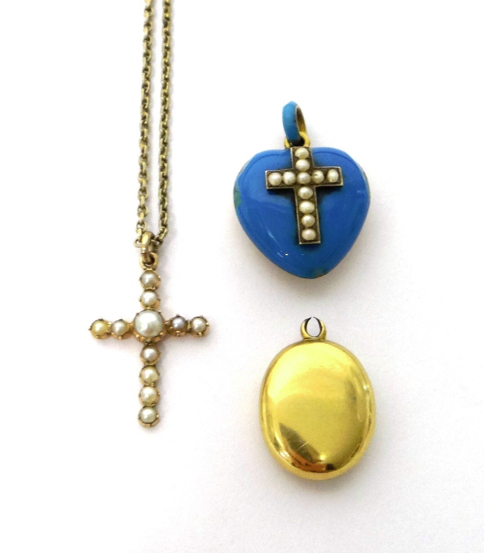 Appraisal: A gold and half pearl set pendant cross with a