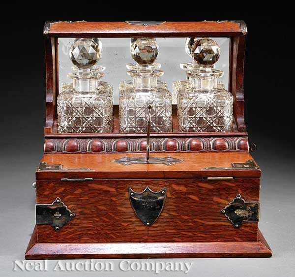 Appraisal: An Antique English Oak and Cut Crystal Tantalus mid- th