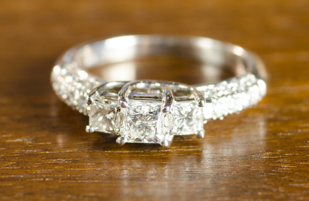 Appraisal: DIAMOND AND EIGHTEEN KARAT WHITE GOLD RING with one princess-cut