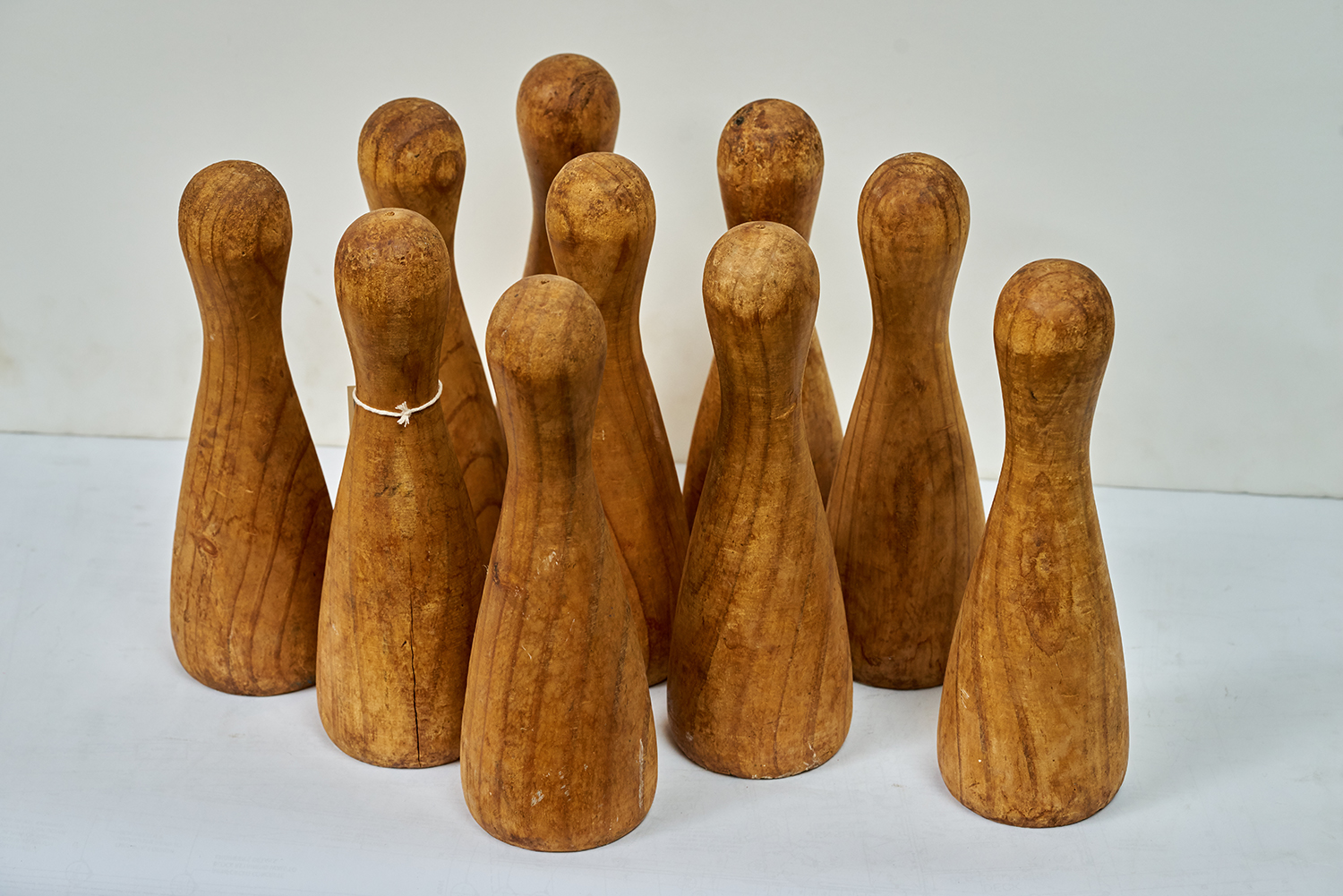 Appraisal: A SET OF TEN EARLY th CENTURY SKITTLES Natural timber