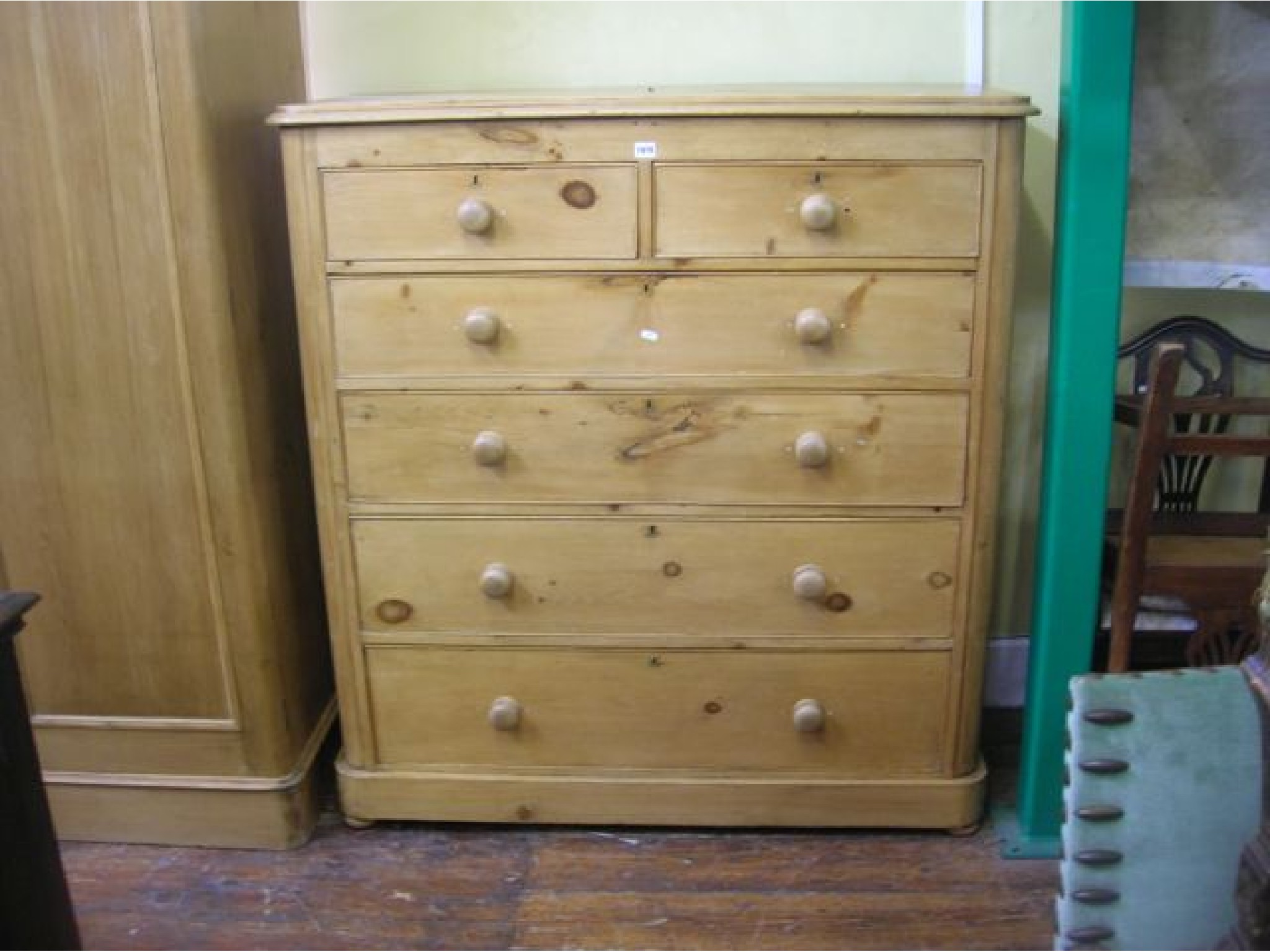 Appraisal: A substantial th century stripped and waxed pine chest of