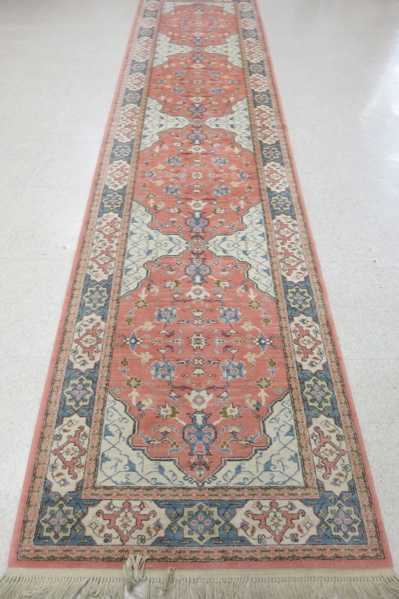 Appraisal: KARASTAN AMERICAN ORIENTAL WIDE RUNNER machine loomed in a traditional