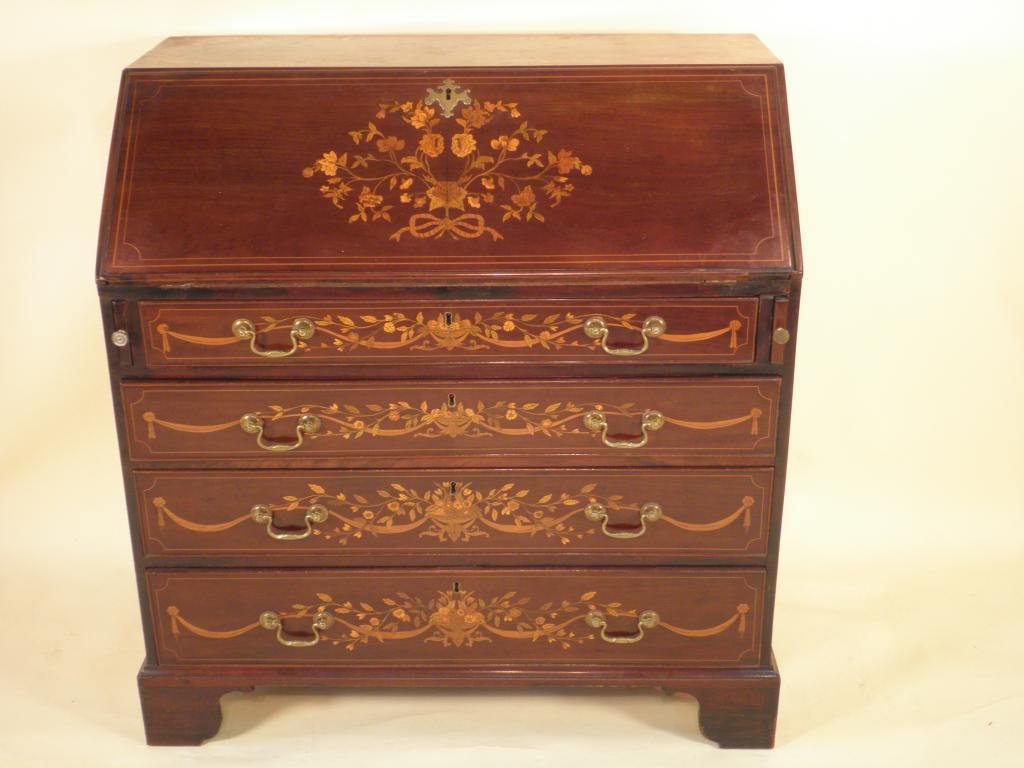 Appraisal: An early thC mahogany and marquetry bureau the top and