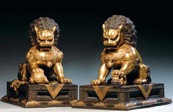 Appraisal: PAIR GILT BRONZE FO LIONS Pair of large and elaborate