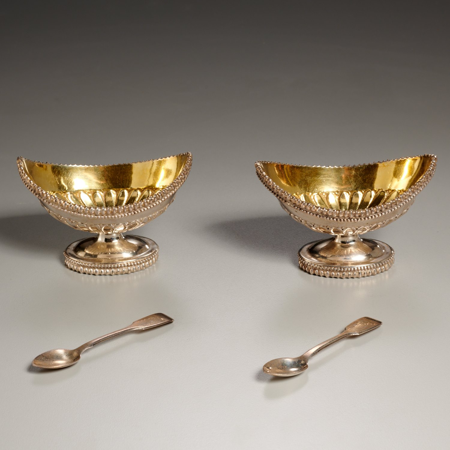 Appraisal: PAIR AMERICAN SILVER SALTS WITH SPOONS c s gold wash