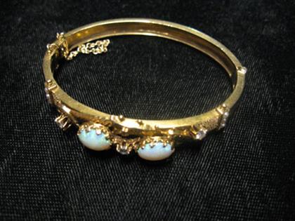 Appraisal: Opal and diamond bracelet Two round white opals set into