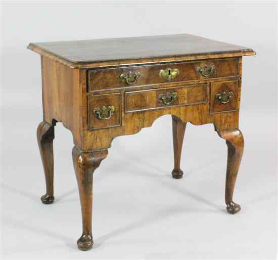 Appraisal: A George II herringbone inlaid walnut lowboy with an arrangement