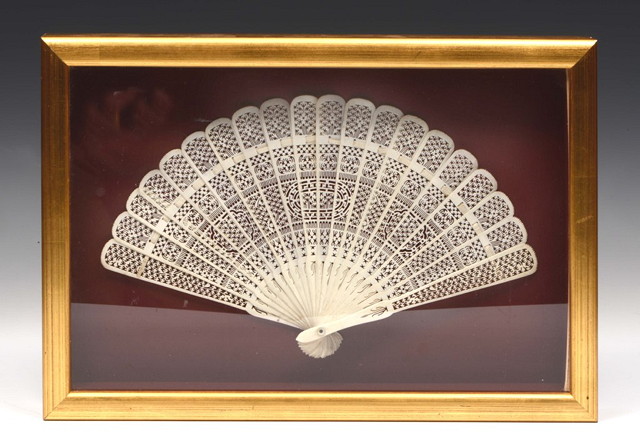 Appraisal: A CANTON IVORY OR BONE FAN with integrate carved decoration