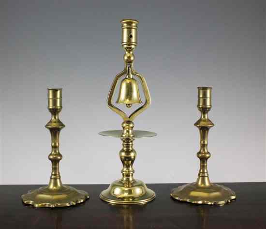 Appraisal: A pair of th century brass candlesticks in and a