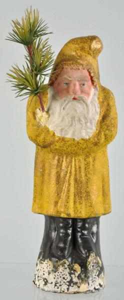 Appraisal: German Belsnickel Santa in Yellow Robe Description Includes tree which