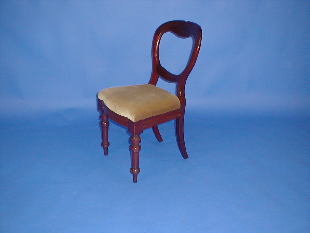 Appraisal: A set of four Victorian mahogany balloon back dining chairs