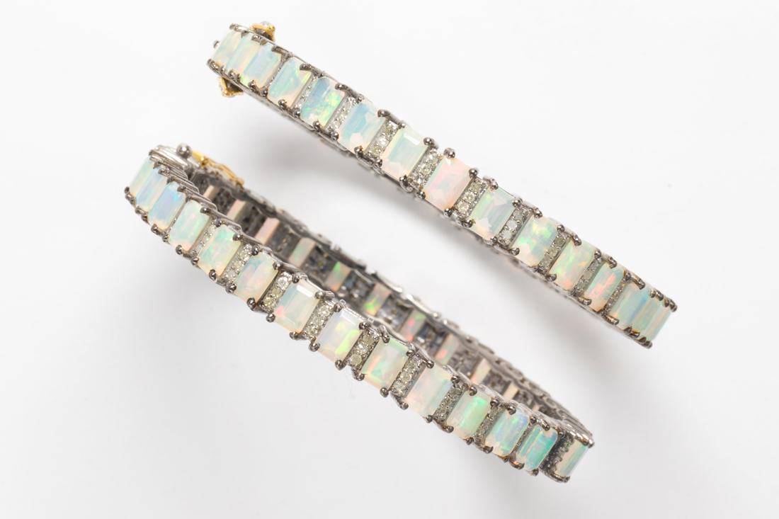 Appraisal: A PAIR OF OPAL AND DIAMOND BRACELETS A pair of