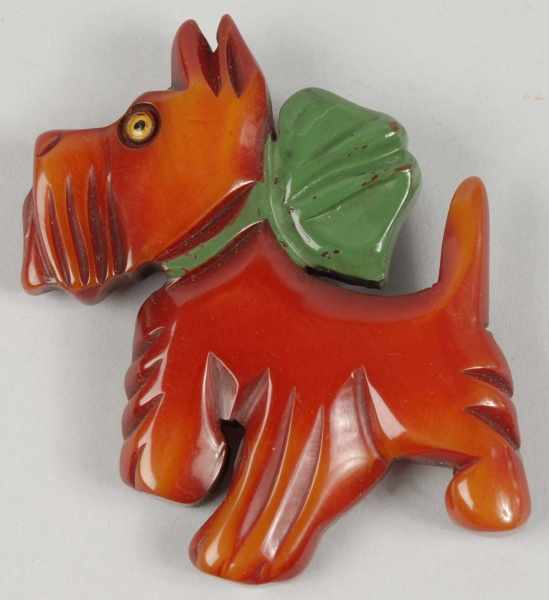 Appraisal: Bakelite Scottie Dog with Green Bow Pin Description Glass eye