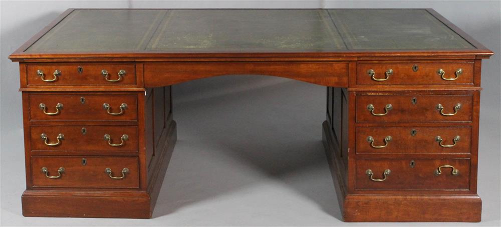 Appraisal: ENGLISH GEORGIAN STYLE MAHOGANY PARTNER'S DESK the rectangular green inset