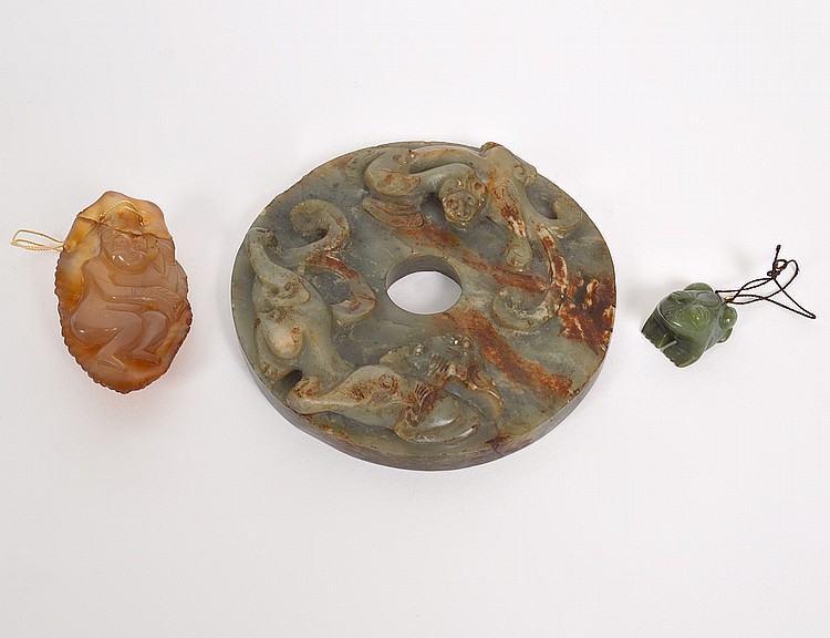 Appraisal: CHINESE ARCHAIC STYLE GREEN BROWN JADE DISCOne side with raised