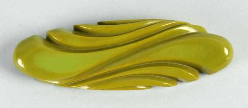 Appraisal: Bakelite Carved Green Bar Pin Condition Excellent Size - L