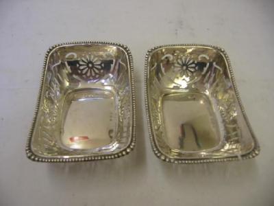 Appraisal: A PAIR OF BONBON DISHES of oblong form with beaded