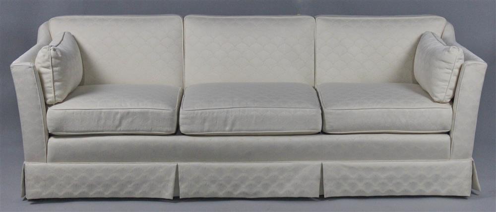 Appraisal: CLASSIC IVORY THREE SEATER SOFA three tight channeled non-removable back