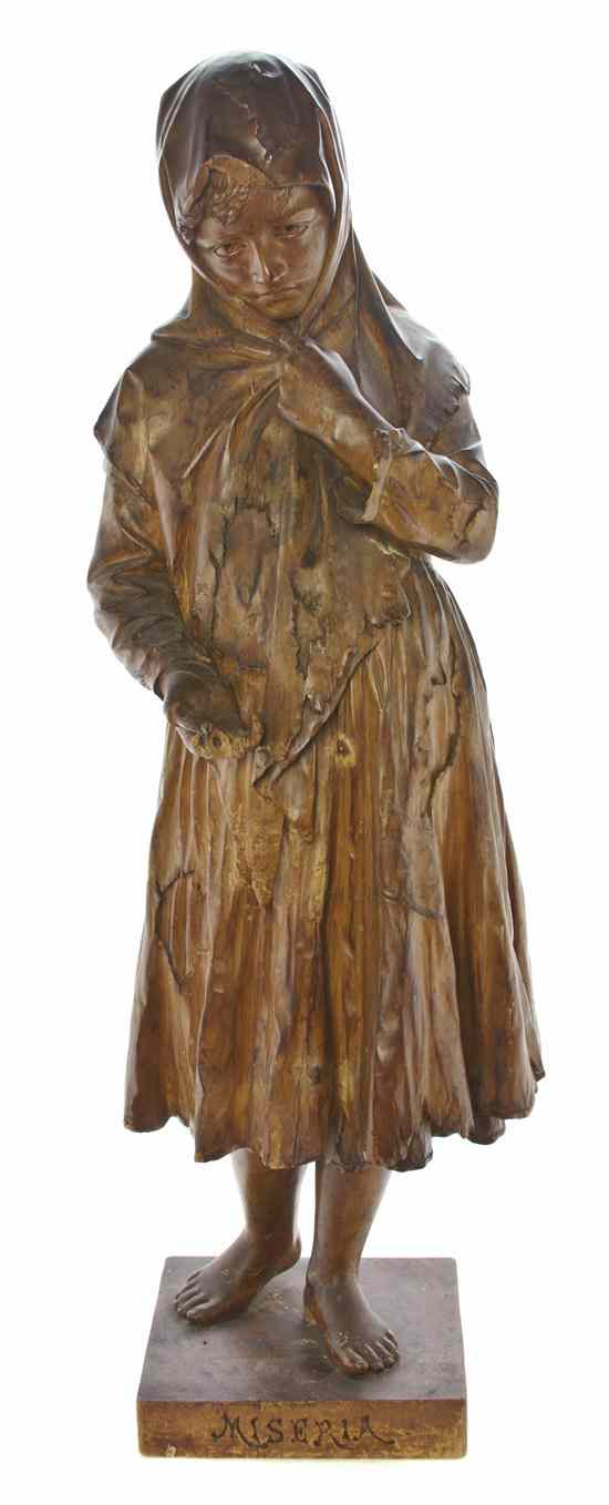 Appraisal: An Italian Carved Wood Figure M Poli Miseria depicting a