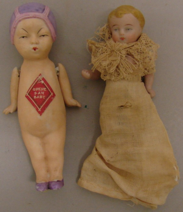 Appraisal: Pair of dolls Queue San Baby with painted features Molded