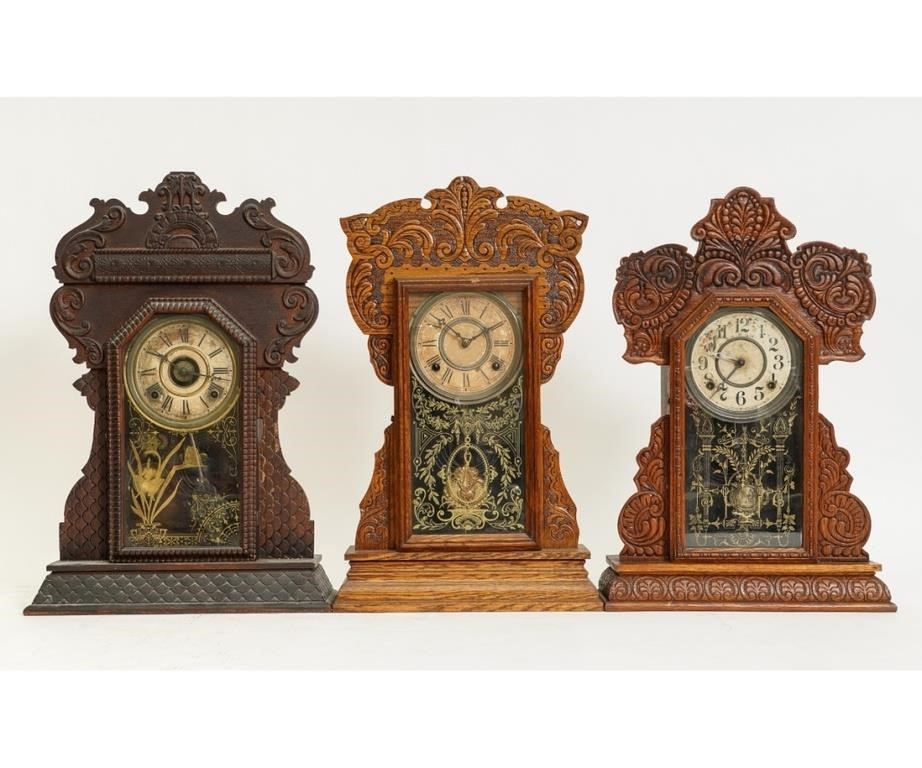 Appraisal: Three oak gingerbread mantel clocks one by Wm Gilbert one