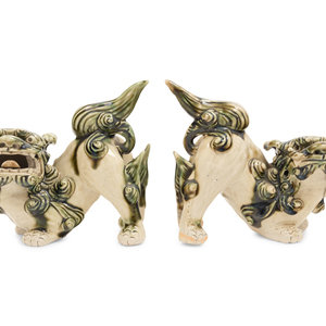 Appraisal: A Pair of Chinese Porcelain Guardian Lions Height x length