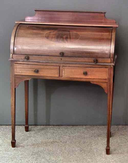 Appraisal: An Edwardian lady's mahogany bureau inlaid with chequered stringings shaped