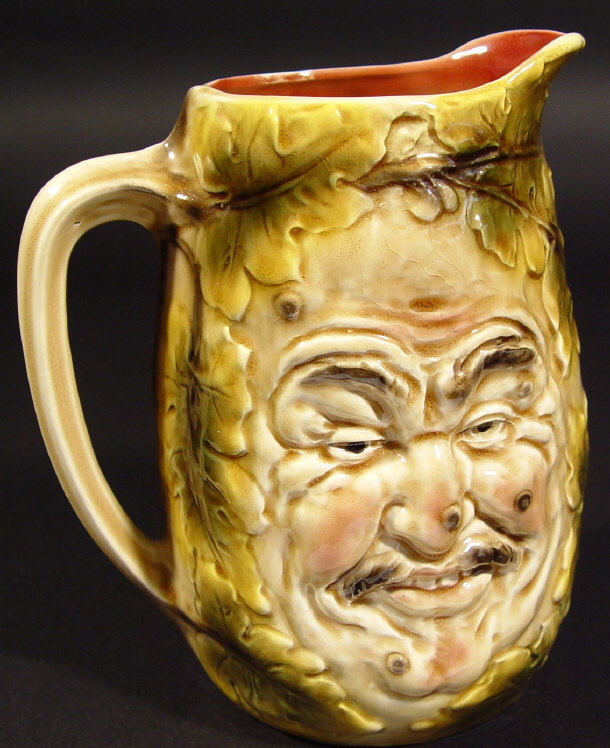 Appraisal: French Majolica pottery double-sided jug moulded with happy and sad