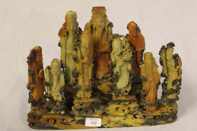 Appraisal: A SOAPSTONE GROUP OF NINE IMMORTALS on a oval base