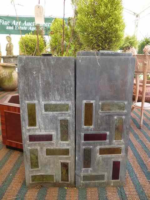 Appraisal: A PAIR OF TALL SQUARE SECTION LEAD PLANTERS inset with