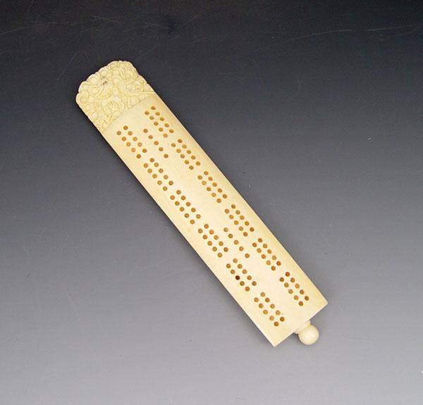 Appraisal: CHINESE CARVED IVORY CRIBBAGE BOARD Carved with dragon design comes