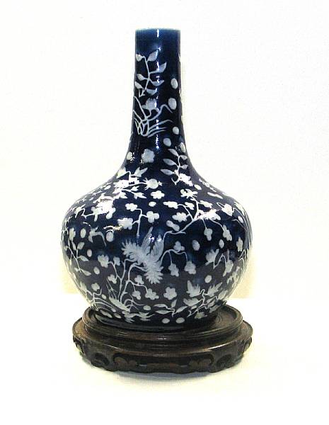 Appraisal: A cobalt ground porcelain stick neck vase with white slip