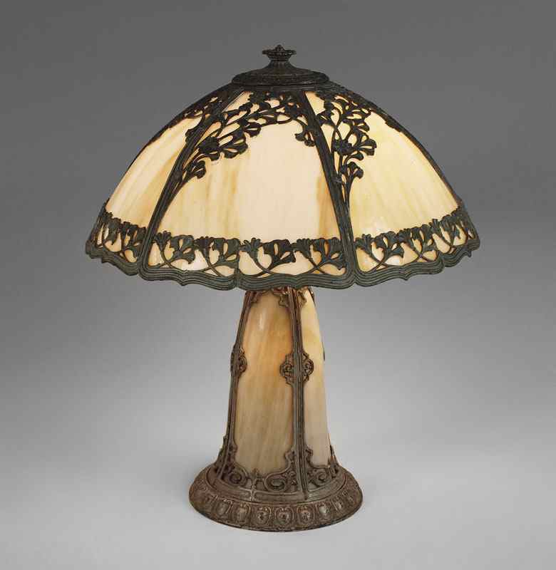 Appraisal: VINTAGE SLAG GLASS LIGHT HOUSE BASE LAMP Filigree metal overlay