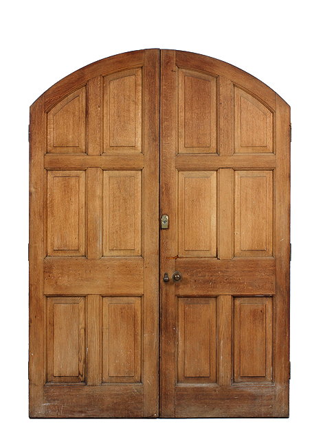 Appraisal: A PAIR OF VICTORIAN OAK ARCHING FRONT DOORS with fielded