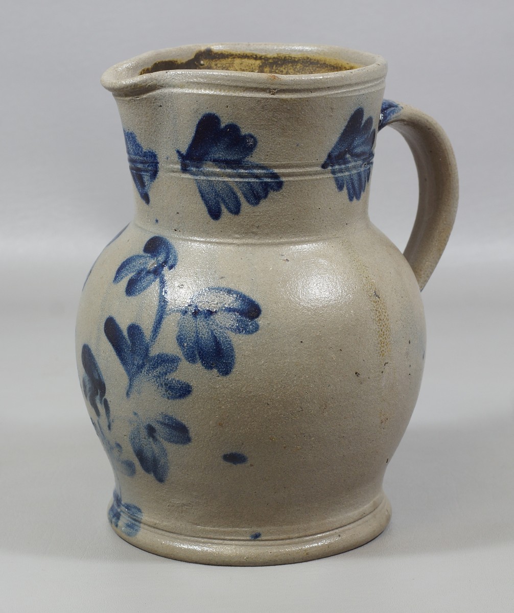 Appraisal: Blue Decorated Stoneware Pitcher with handle high no condition issues