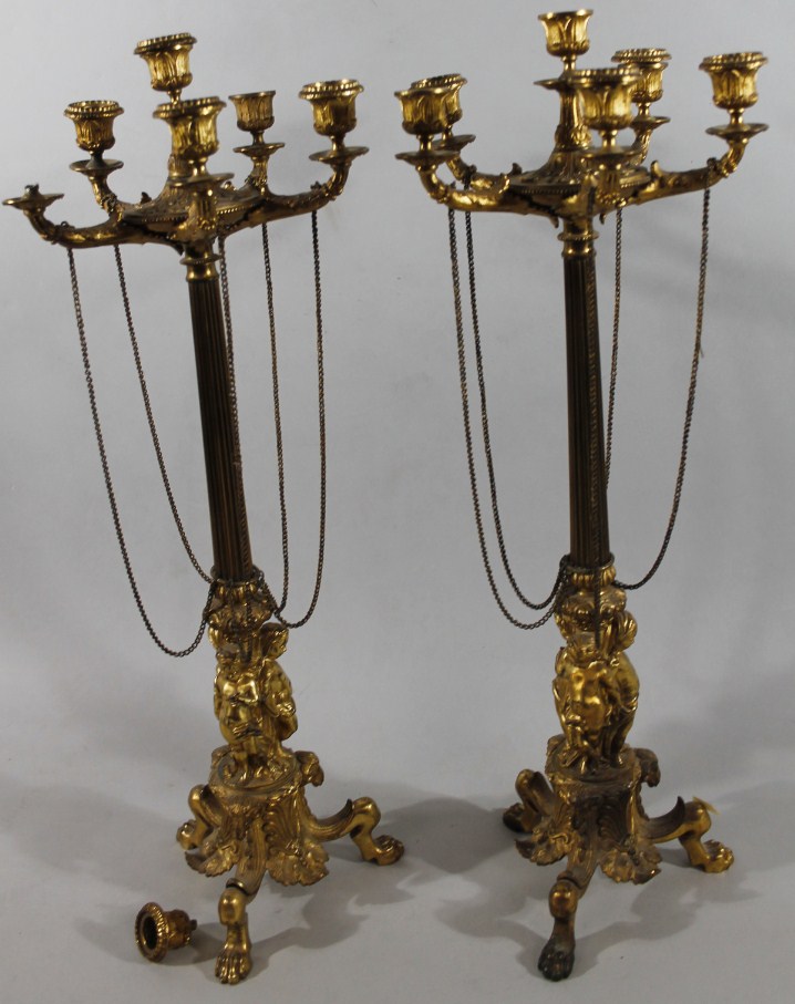 Appraisal: A pair of early thC gilt metal candelabra garniture each