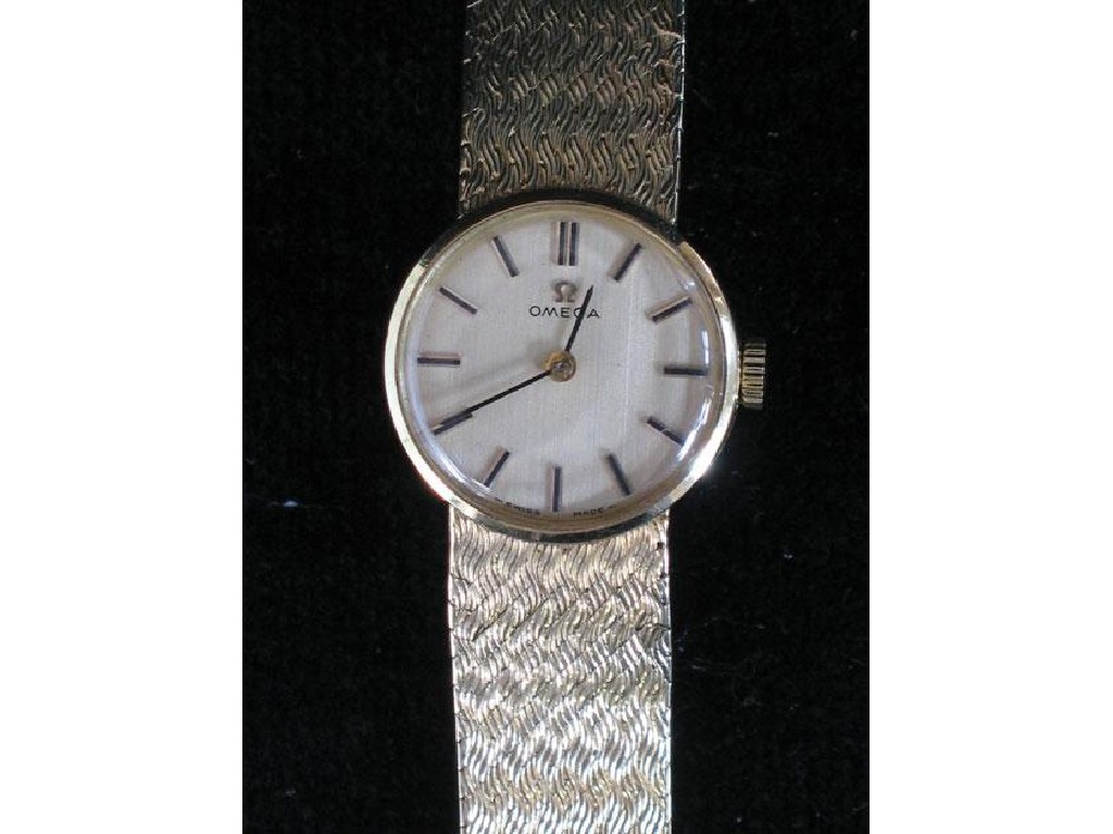 Appraisal: A LADIES OMEGA CT GOLD WRISTWATCH the champagne dial with